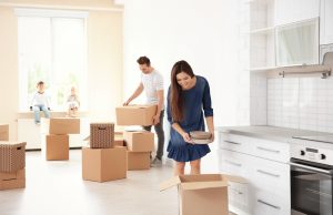 family unpacking boxes