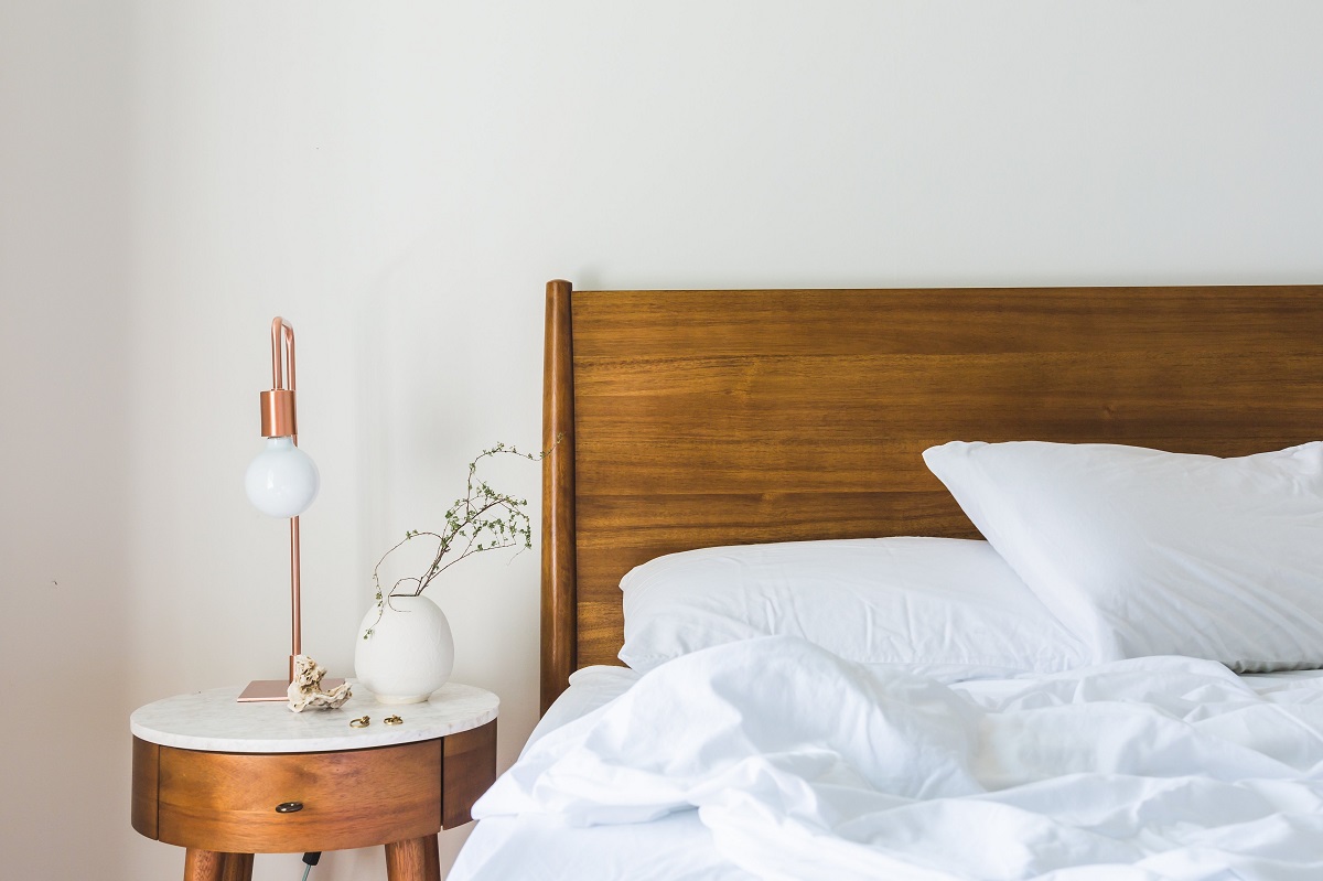 lamp by bed in bedroom