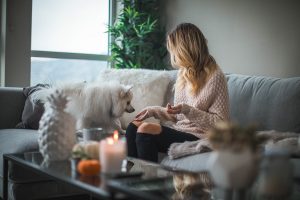 woman and dog in a cozy home