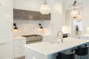 white kitchen with an island in new home floor plan.